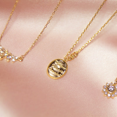 14kt Gold "Love Conquers All" Diamond Pendant