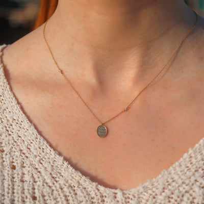 14kt Gold "Love Conquers All" Diamond Pendant