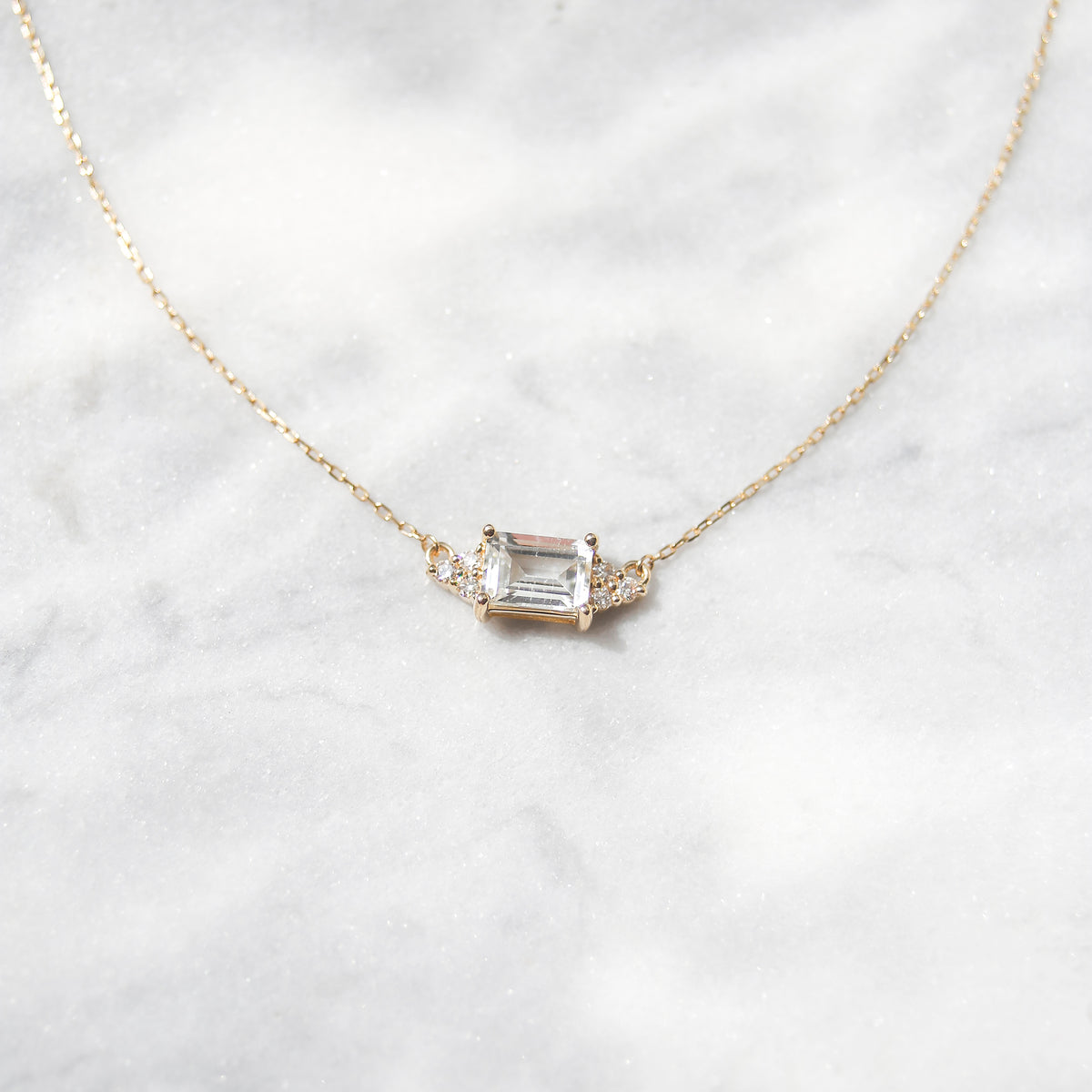 Solid Gold White Topaz & Diamond Baguette Pendant