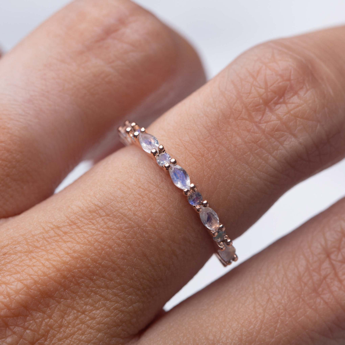 Solid Rose Gold Rainbow Moonstone Eternity Marquise Band