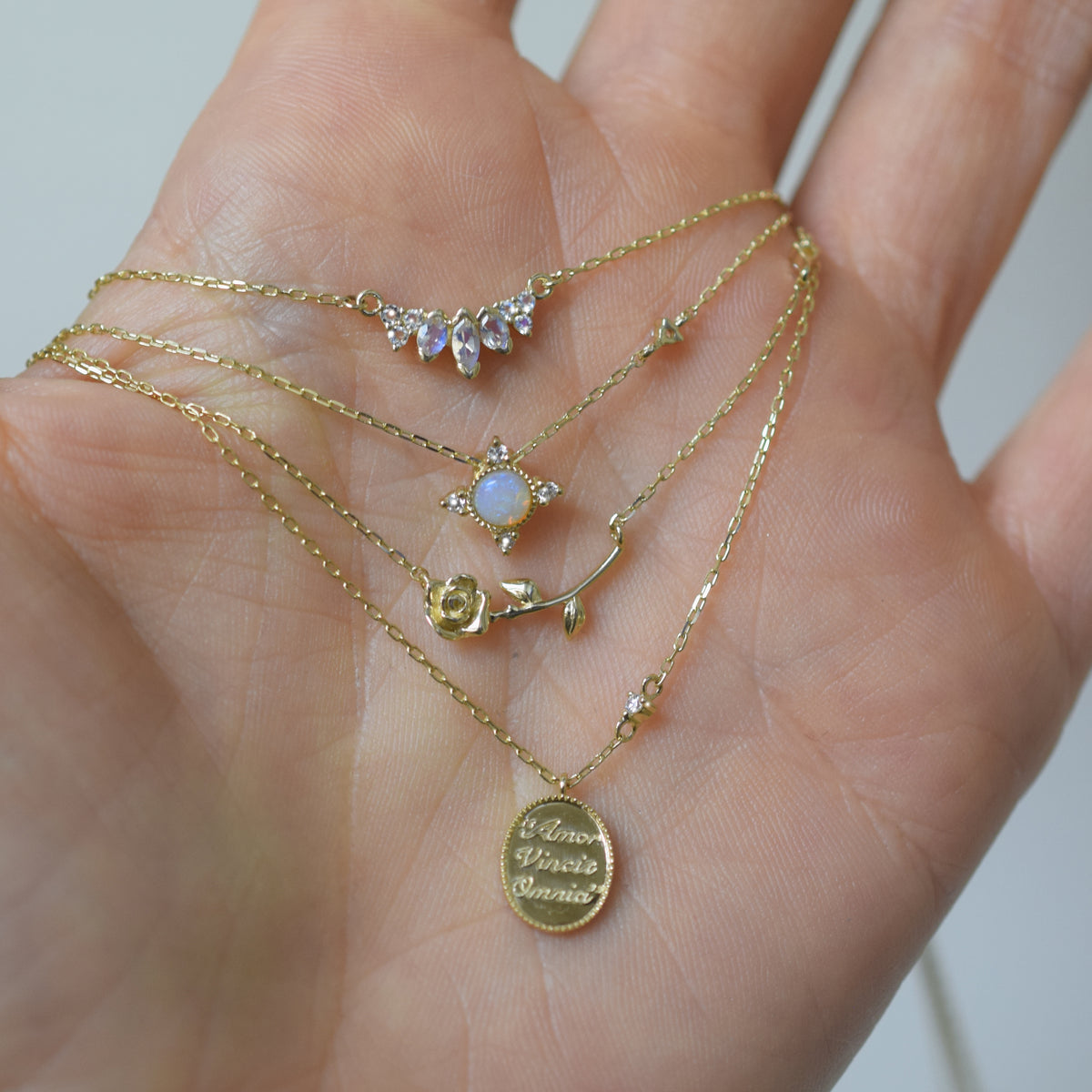 14kt Gold "Love Conquers All" Diamond Pendant